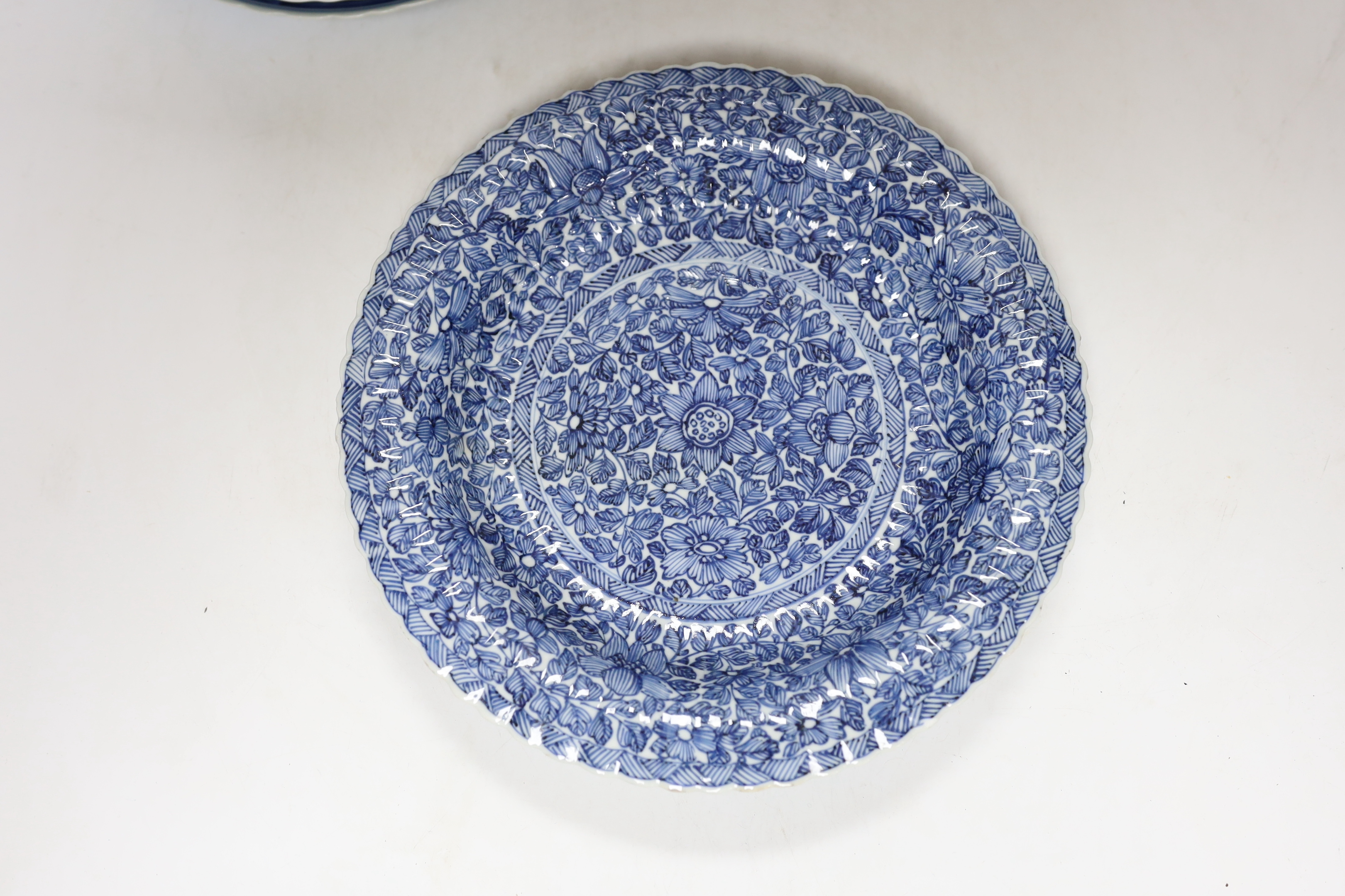 A group of Chinese blue and white dishes and plates and a damaged vase, 30cm